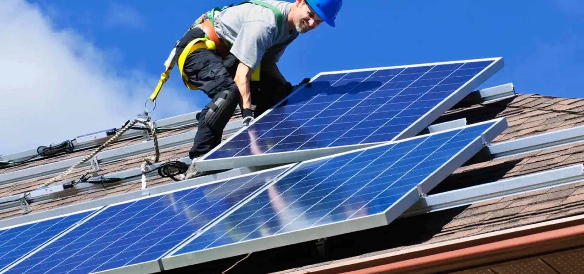 Solar technician installing panels