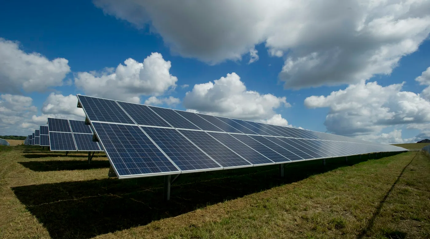 Solar farm with wind turbines